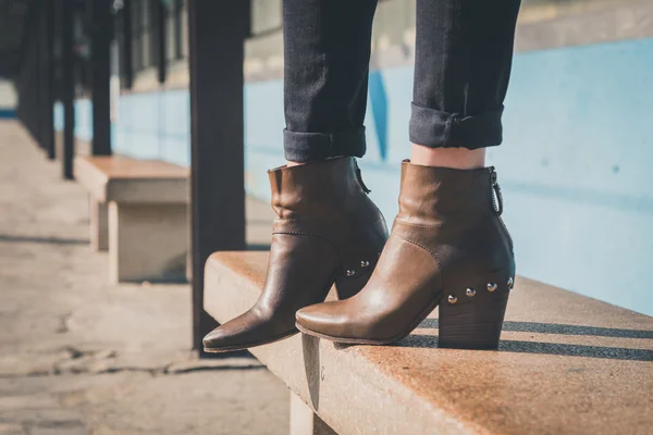 Detail of ankle boots in a metro station — Stock Photo, Image