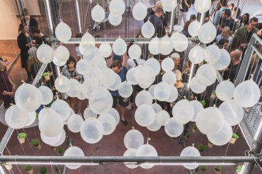 People visiting Ventura Lambrate space during Milan Design Week clipart