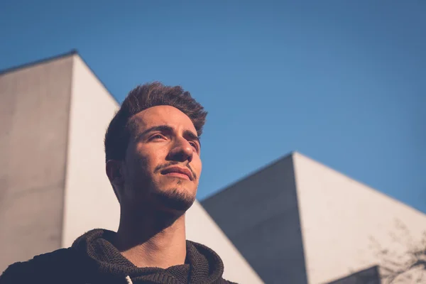 Young  man posing in an urban context — Stock Photo, Image