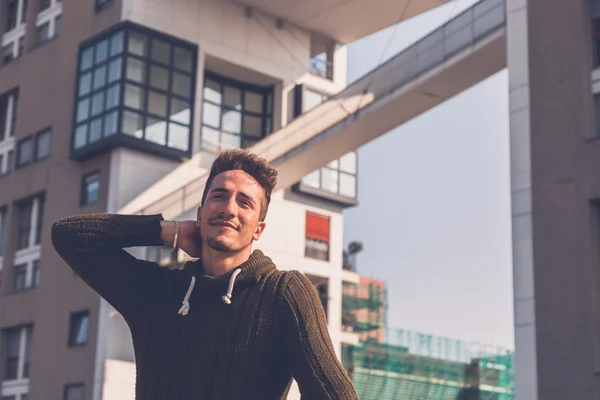 Young  man posing in an urban context — Stock Photo, Image