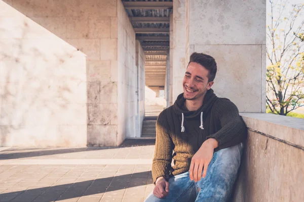 Young  man posing in an urban context — Stock Photo, Image