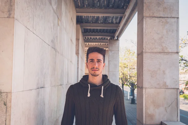 Young  man posing in an urban context — Stock Photo, Image