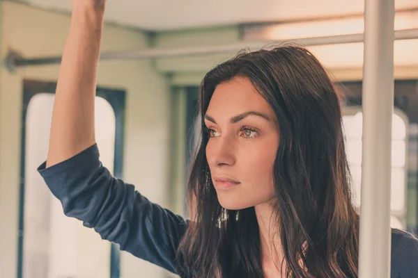 Beautiful girl posing in a metro car — Stock Photo, Image