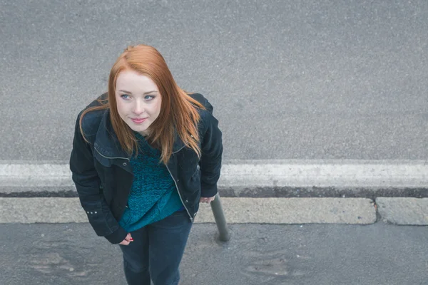 Top view of a beautiful girl posing in the city streets — Stock Photo, Image