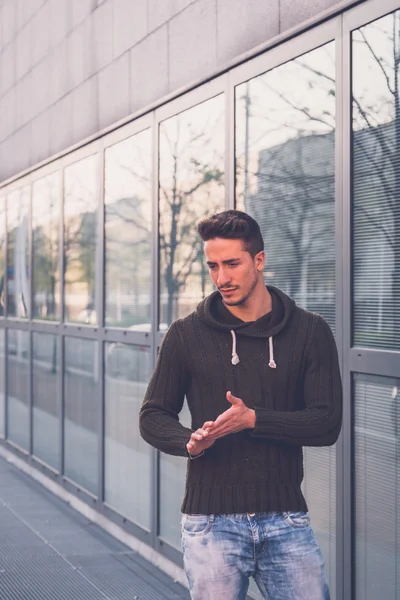 Young  man posing in an urban context — Stock Photo, Image