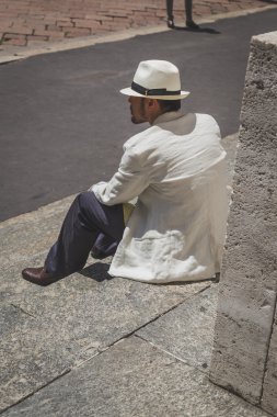 People outside Ferragamo fashion show building for Milan Men's F