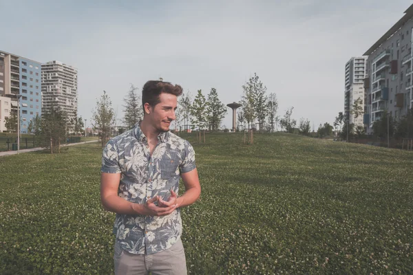 Young handsome man posing in the street — Stock Photo, Image