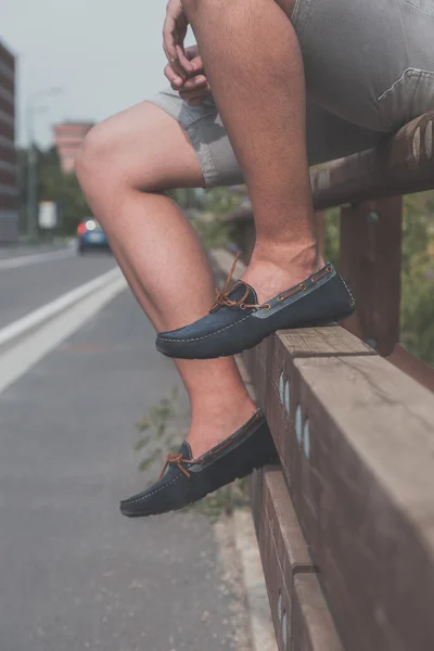 Detail of a young handsome man posing in the street — Stock Photo, Image