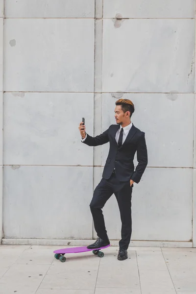 Young handsome Asian model taking a selfie — Stock Photo, Image