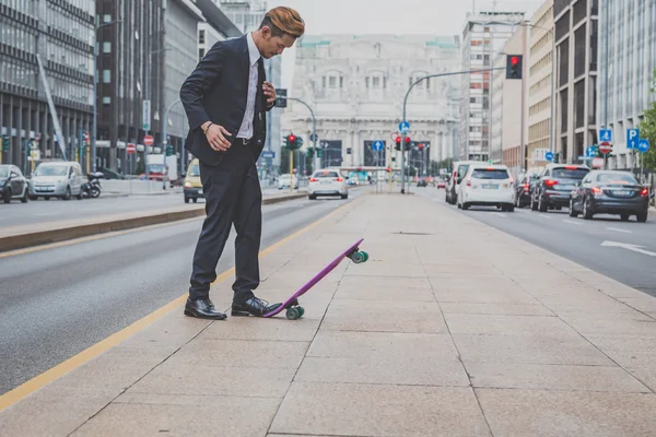 Young handsome Asian model posing with his skateboard — Stock Photo, Image