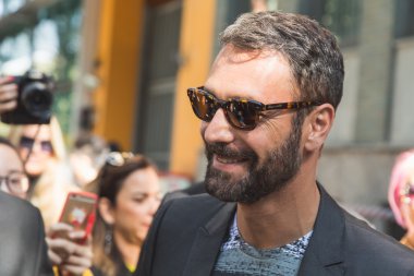 Actor Raoul Bova posing outside Emporio Armani fashion show buil