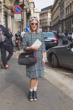 People gather outside Ferragamo fashion show building in Milan,