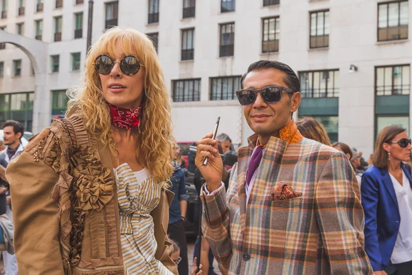 People gather outside Ferragamo fashion show building in Milan, — стокове фото