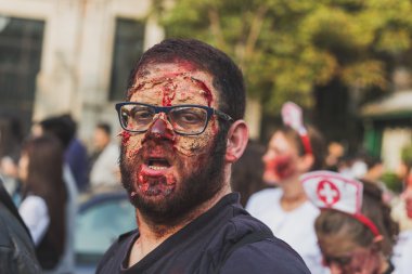People take part in the Zombie Walk 2015 in Milan, Italy