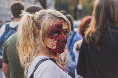 People take part in the Zombie Walk 2015 in Milan, Italy