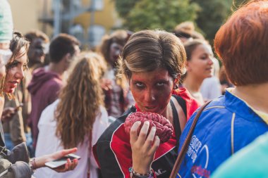 People take part in the Zombie Walk 2015 in Milan, Italy