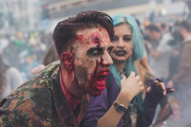 People take part in the Zombie Walk 2015 in Milan, Italy