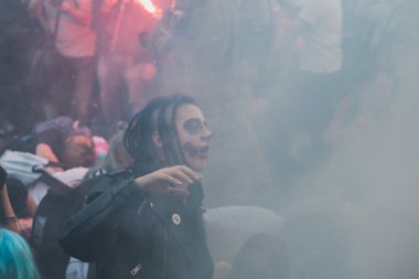 People take part in the Zombie Walk 2015 in Milan, Italy