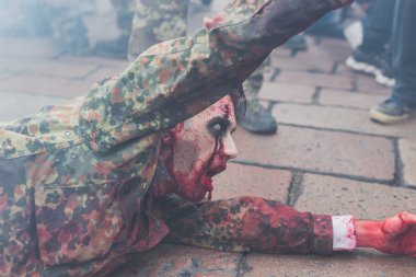 People take part in the Zombie Walk 2015 in Milan, Italy