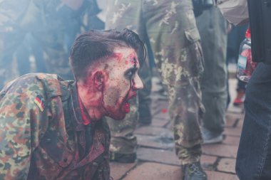 People take part in the Zombie Walk 2015 in Milan, Italy