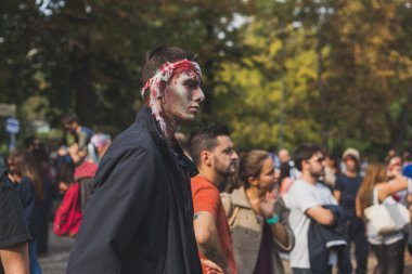 People take part in the Zombie Walk 2015 in Milan, Italy