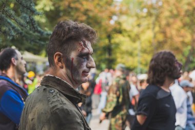 People take part in the Zombie Walk 2015 in Milan, Italy