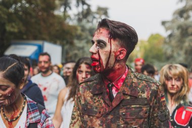 People take part in the Zombie Walk 2015 in Milan, Italy