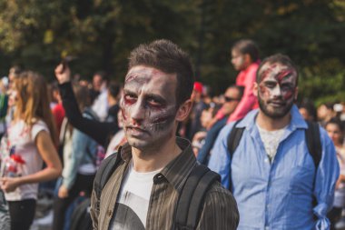 People take part in the Zombie Walk 2015 in Milan, Italy
