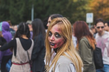 People take part in the Zombie Walk 2015 in Milan, Italy
