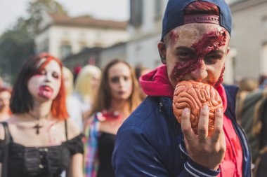 People take part in the Zombie Walk 2015 in Milan, Italy