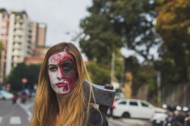 People take part in the Zombie Walk 2015 in Milan, Italy