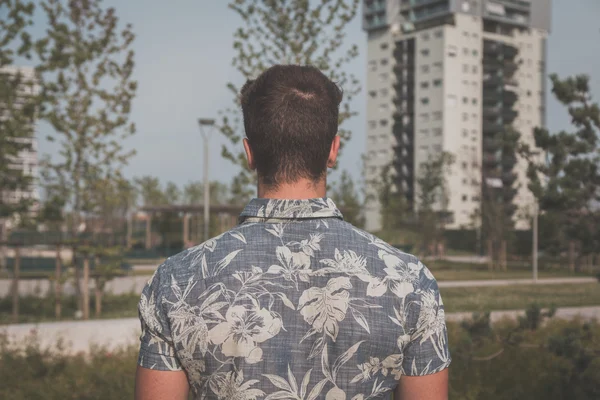 Detail of a young handsome man posing in the street — Stock Photo, Image