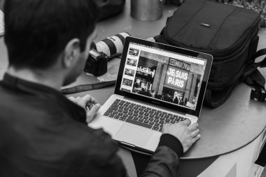Photographer at work during a demonstration against terrorism in