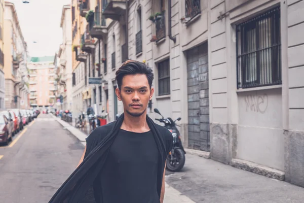 Handsome Asian model posing in the city streets — Stock Photo, Image