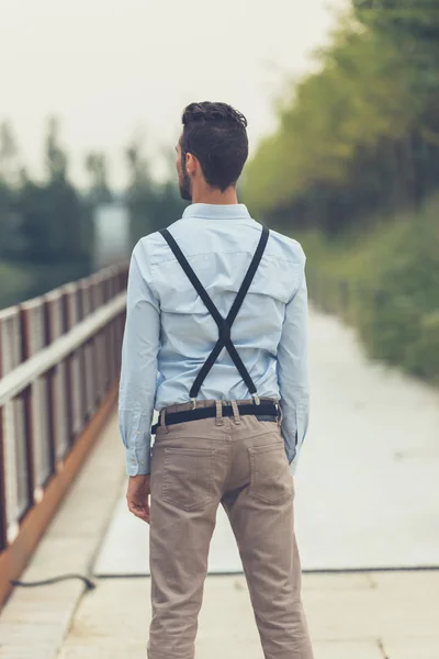 Young handsome man posing in an urban context — Stock Photo, Image