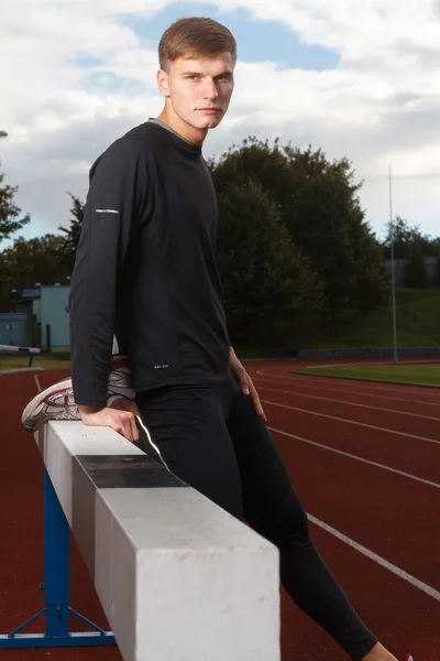 Portrait of sexy muscle man posing on stadium — Stock Photo, Image