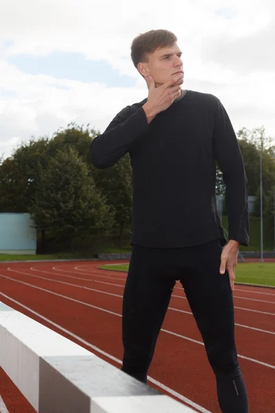 Portrait of sexy muscle man posing on stadium — Stock Photo, Image