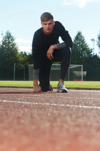 Portrait of sexy muscle man posing on stadium — Stock Photo, Image