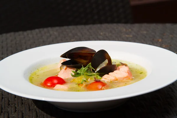 Image of tasty salmon soup with oysters in dish — Stock Image Image of tasty salmon soup with oysters in dish Royalty Free Stock Images