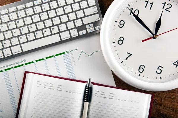 Business still life with clock — Stock Photo, Image