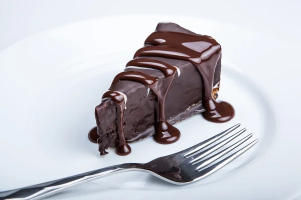 Chocolate cake on a plate close up — Stock Photo, Image