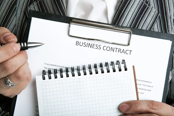 Leader holding a business contract Stock Photo