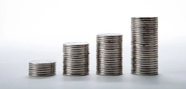 Stacks of coins on a white background — Stock Photo, Image