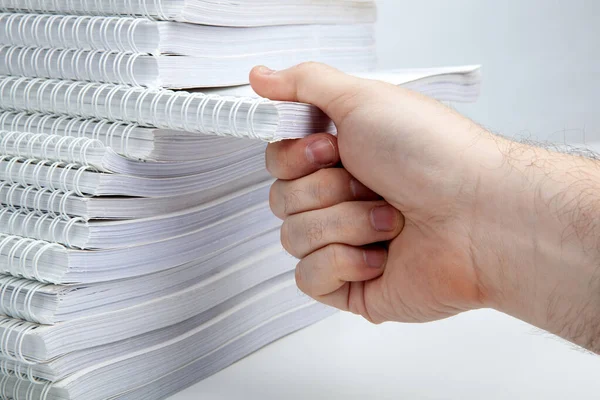 Man Hand Takes One Notebook Stack Notebooks Close — Stock fotografie