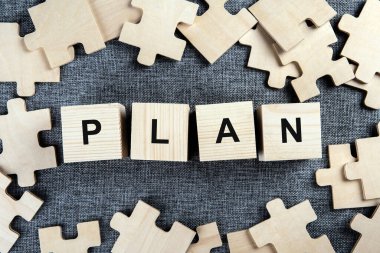 Tekstil arkaplanındaki bulmaca ögeleri yazma planları üst görünümü olan bir bilmece gibi