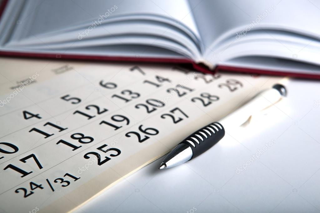 calendar days with numbers and pen