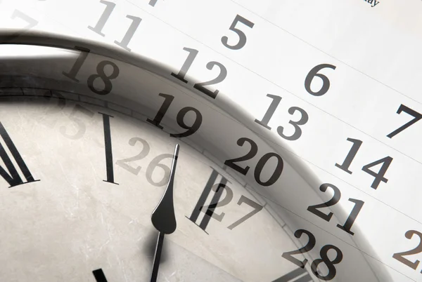 Blatt eines Kalenders mit der Anzahl der Tage und der Uhr — Stockfoto