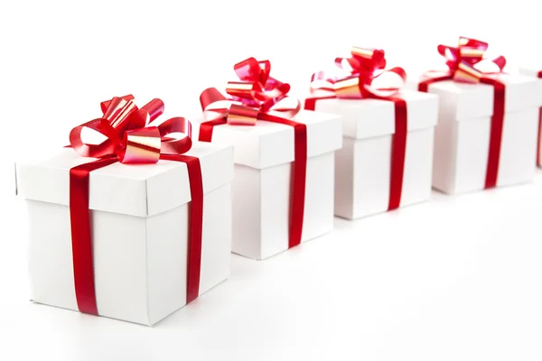 White gift boxes on gray — Stock Photo, Image