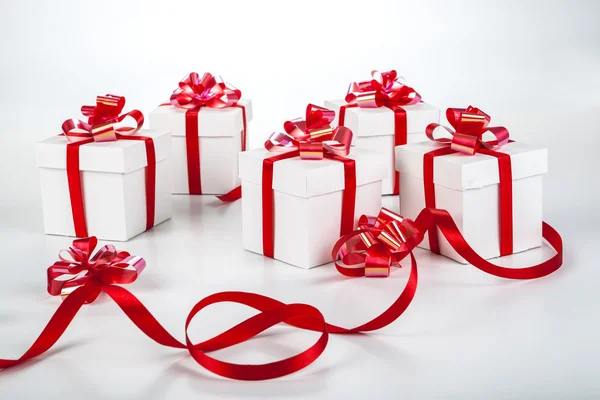 White gift boxes on gray — Stock Photo, Image