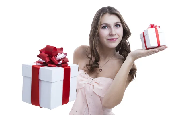 Girl in a pink dress holding a gift box — Stock Photo, Image